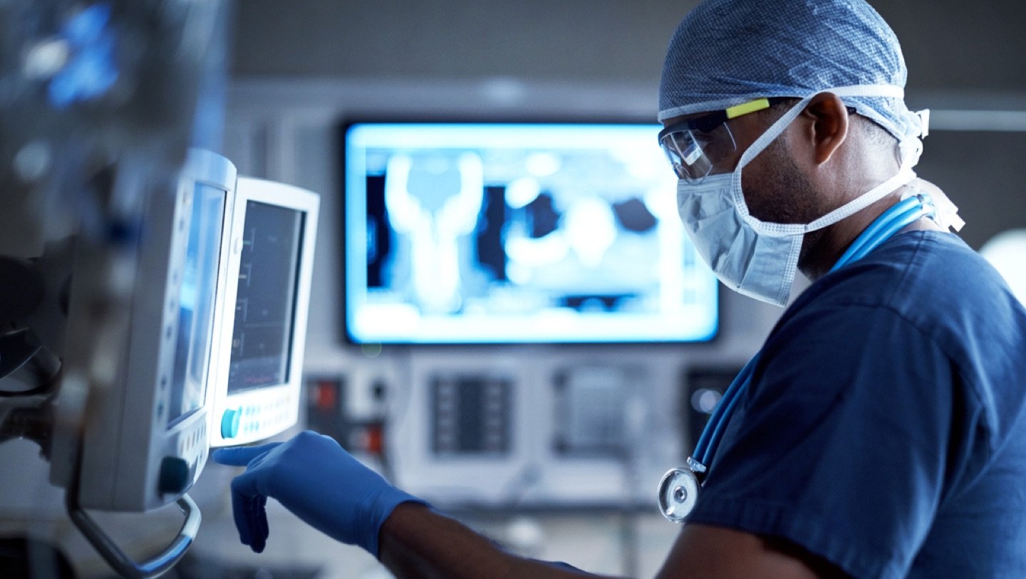 interventional radiologist reviewing a diagnostic image